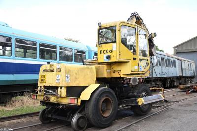 image showing a large yellow on-track machine