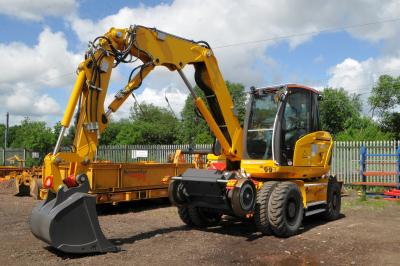 image showing a large yellow on-track machine