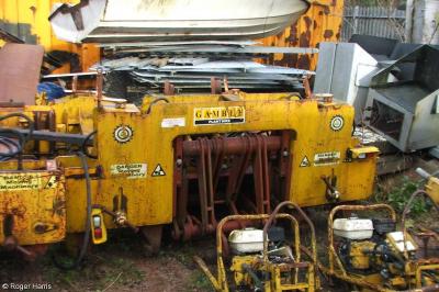 image showing a large yellow on-track machine