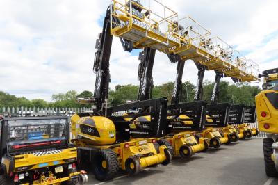 image showing a large yellow on-track machine