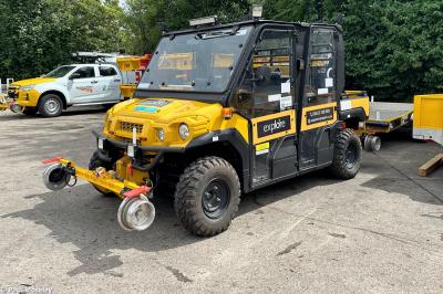 image showing a large yellow on-track machine