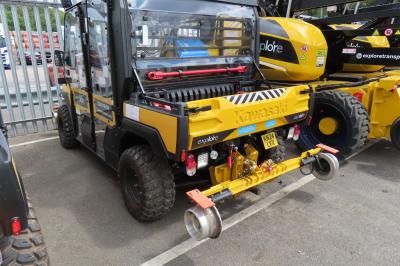 image showing a large yellow on-track machine