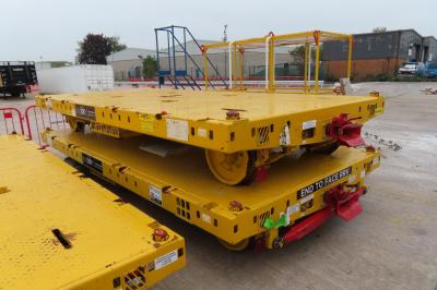 image showing a large yellow on-track machine