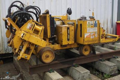 image showing a large yellow on-track machine