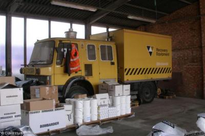 image showing a large yellow on-track machine