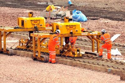 image showing a large yellow on-track machine