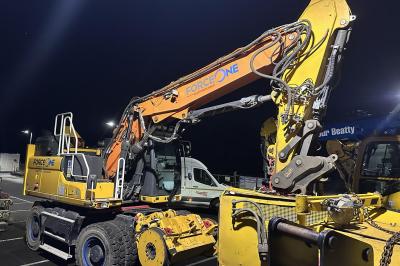 image showing a large yellow on-track machine