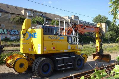 image showing a large yellow on-track machine