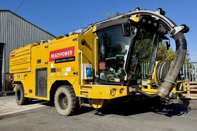 image showing a large yellow on-track machine