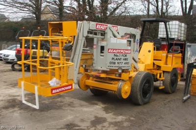image showing a large yellow on-track machine