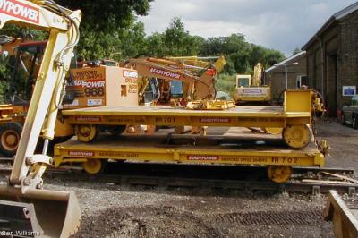 image showing a large yellow on-track machine
