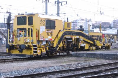 image showing a large yellow on-track machine