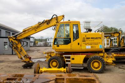 image showing a large yellow on-track machine