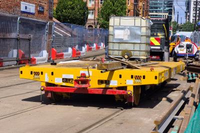 image showing a large yellow on-track machine