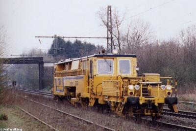 image showing a large yellow on-track machine