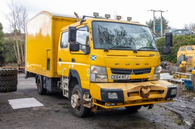 image showing a large yellow on-track machine