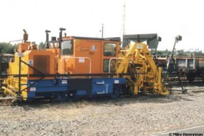 image showing a large yellow on-track machine