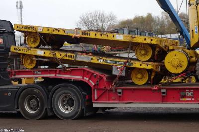 image showing a large yellow on-track machine