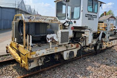 image showing a large yellow on-track machine