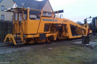 image showing a large yellow on-track machine