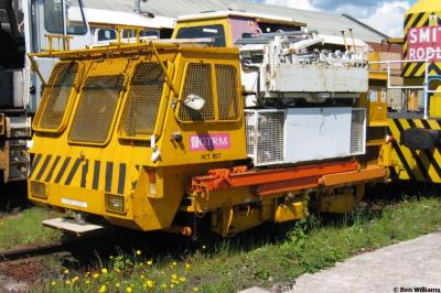 image showing a large yellow on-track machine
