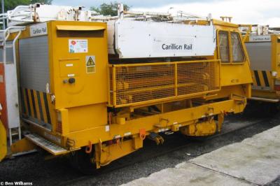 image showing a large yellow on-track machine