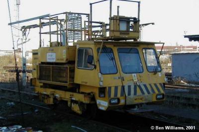 image showing a large yellow on-track machine