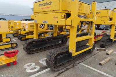 image showing a large yellow on-track machine