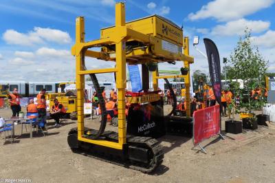 image showing a large yellow on-track machine