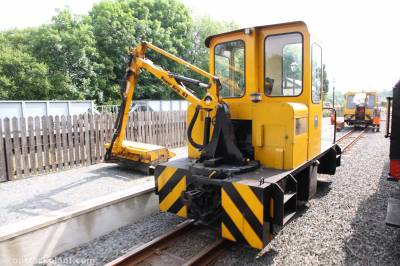 image showing a large yellow on-track machine