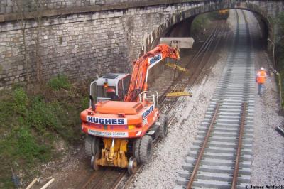 image showing a large yellow on-track machine