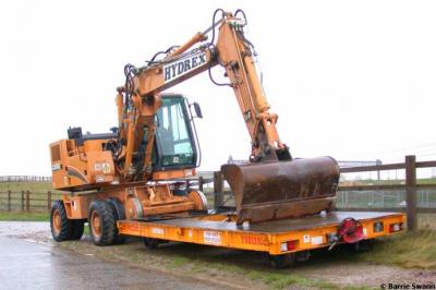 image showing a large yellow on-track machine