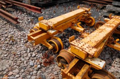 image showing a large yellow on-track machine