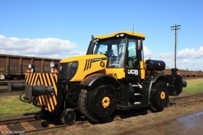 image showing a large yellow on-track machine