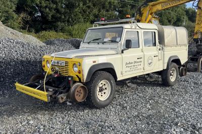 image showing a large yellow on-track machine