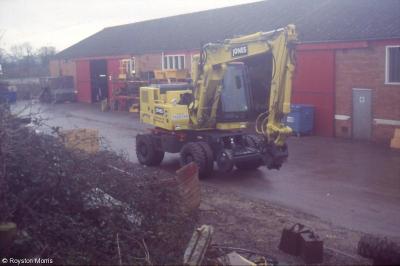 image showing a large yellow on-track machine