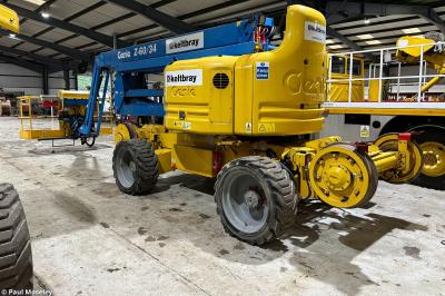 image showing a large yellow on-track machine