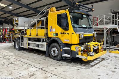 image showing a large yellow on-track machine