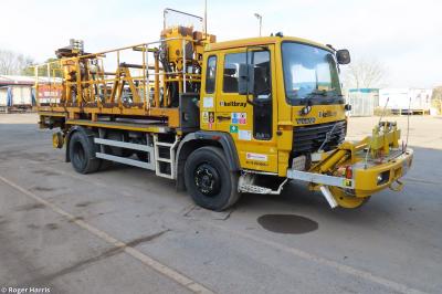 image showing a large yellow on-track machine