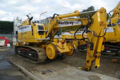 image showing a large yellow on-track machine