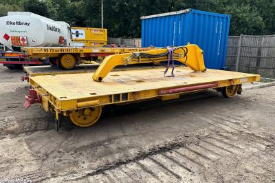 image showing a large yellow on-track machine