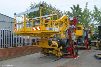 image showing a large yellow on-track machine