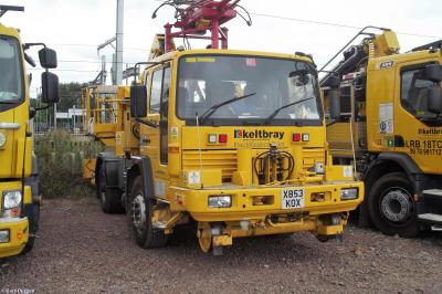 image showing a large yellow on-track machine