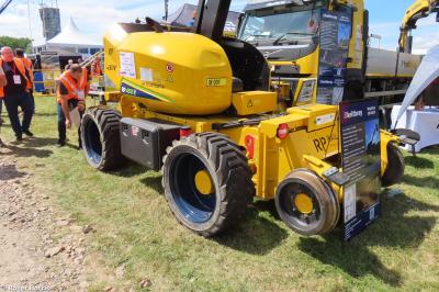image showing a large yellow on-track machine