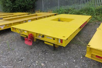 image showing a large yellow on-track machine
