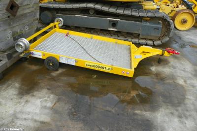 image showing a large yellow on-track machine
