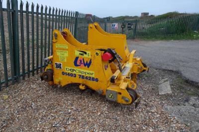 image showing a large yellow on-track machine