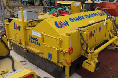 image showing a large yellow on-track machine