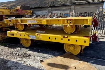 image showing a large yellow on-track machine