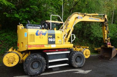 image showing a large yellow on-track machine
